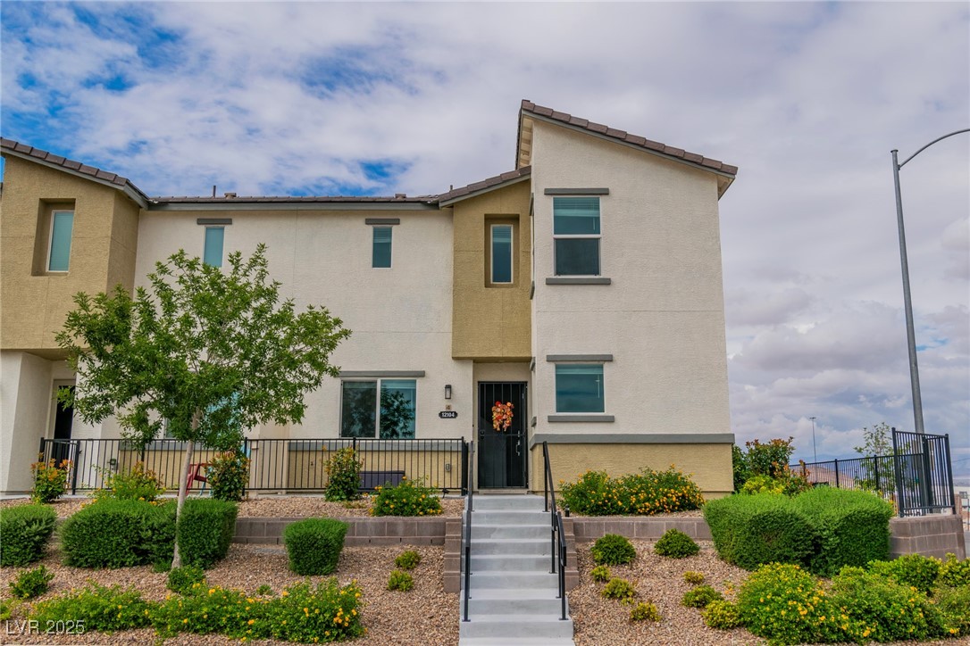 View of front of property with stucco siding