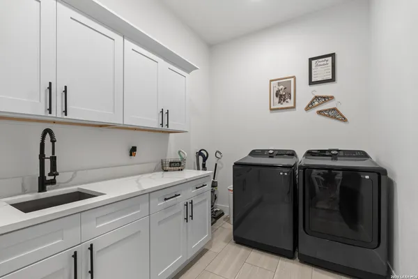 a view of a sink and cabinets