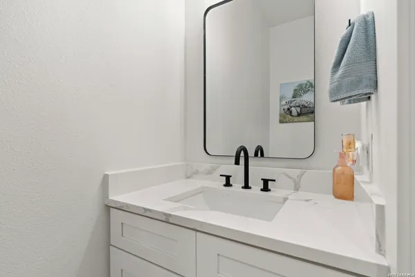 a bathroom with a sink and a mirror