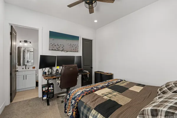 a bedroom with a bed and a television