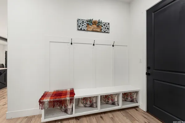 a view of a room with wooden floor