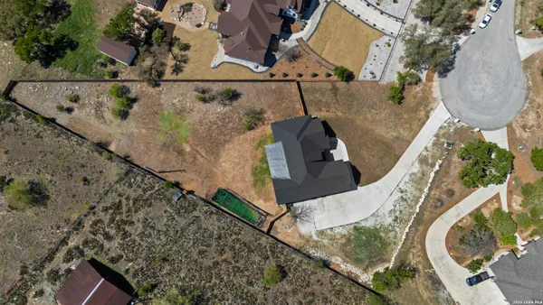 an aerial view of a house with swimming pool