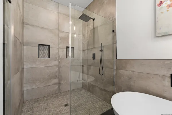 a bathroom with a toilet and shower