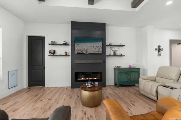 a bedroom with furniture and a fireplace