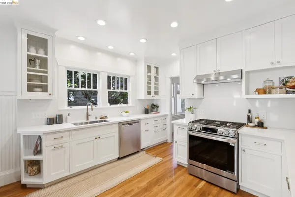 a living room with furniture and large windows