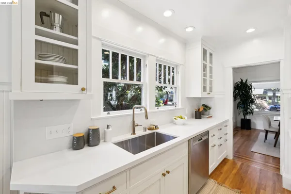 a living room with furniture and a book shelf
