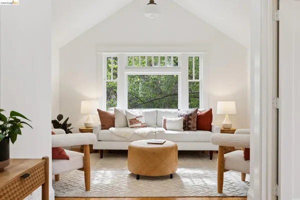 a spacious bedroom with a bed and a large window