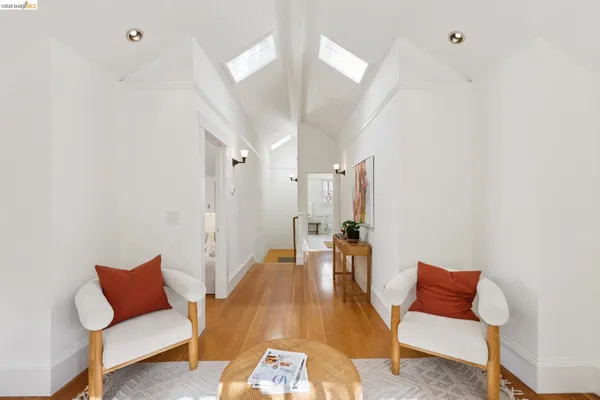 a bedroom with bed a table and chair