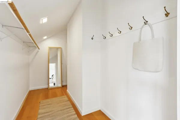 a view of a chair and table in backyard of the house