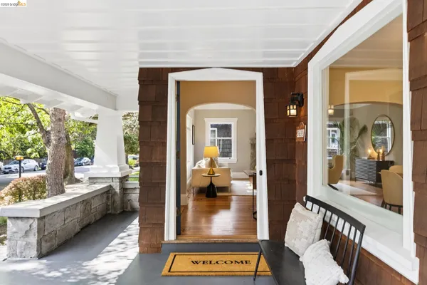 a living room with furniture a fireplace and a table