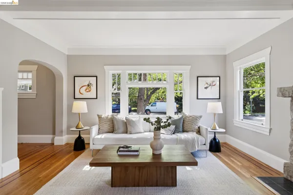 a view of a dining room with furniture and wooden floor