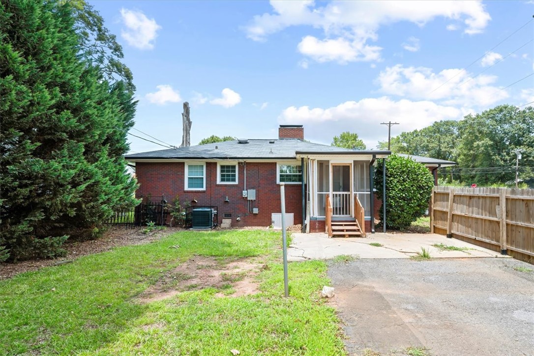 212 East Shockley Ferry Road Anderson, SC 29624 - Photo 27 of 28 A well-maintained brick exterior and fenced yard define this charming residence.