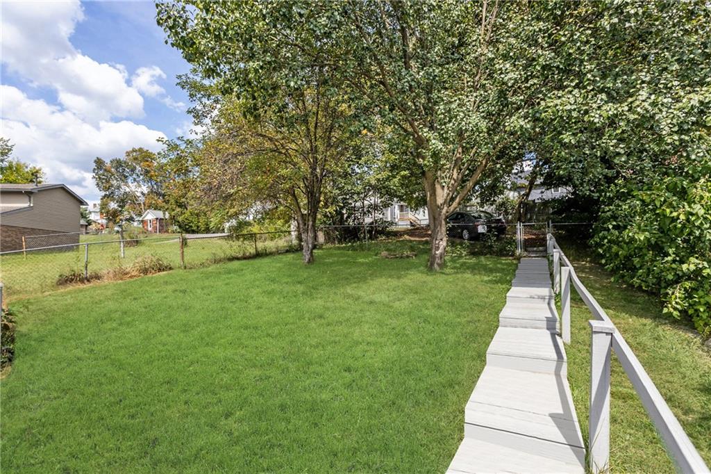 118 Oak Spring Road Canonsburg, PA 15317 - Photo 21 of 32 Parking area at the back of the property provides extra off-street parking. Surrounded by trees, it adds both practicality and privacy.