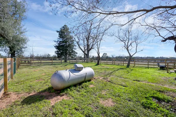 a living room with fireplace furniture and a wooden floor