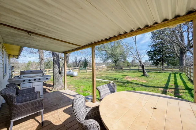 a kitchen with a stove a sink and a refrigerator