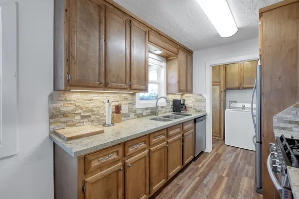 a view of a house with yard and tree s
