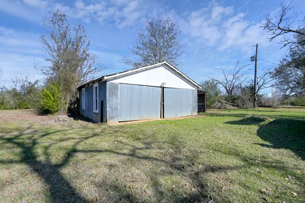 a living room with furniture a chandelier and a chandelier