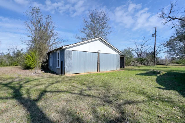 a living room with furniture a chandelier and a chandelier