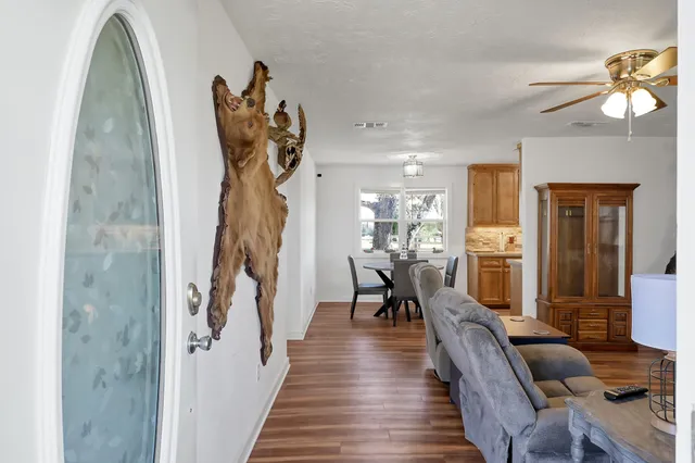 wooden floor in an empty room with a window