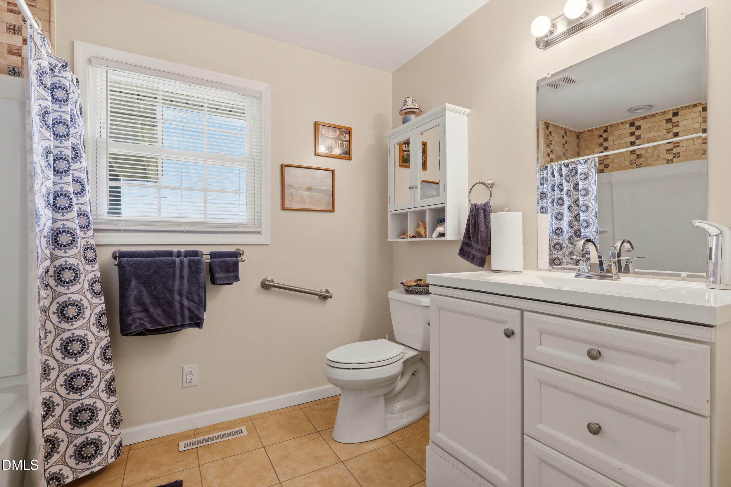 2631 South Jim Minor Road Haw River, NC 27258 - Photo 32 of 62 a bathroom with a granite countertop sink a toilet and a mirror