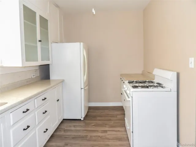 a kitchen with stainless steel appliances a refrigerator and a stove