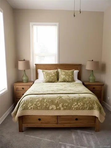 a bedroom with a bed and window