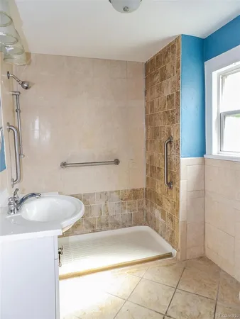 a bathroom with a sink and a shower
