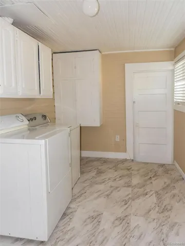 a bedroom with bed and a window