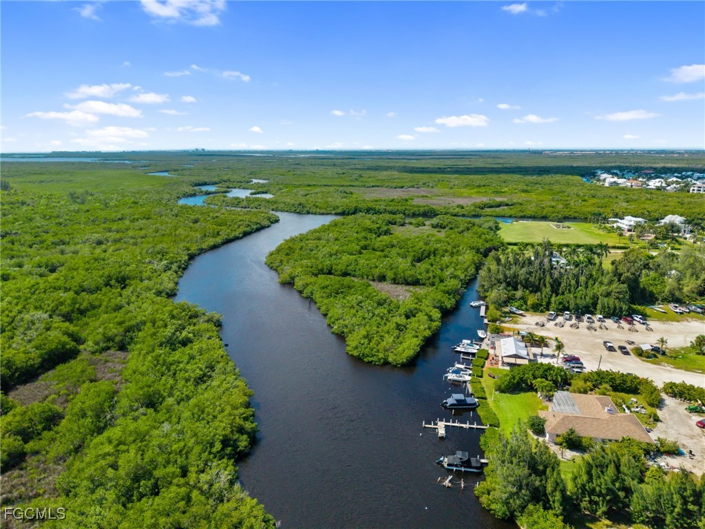 18181 Pioneer Road Fort Myers, FL 33908 - Photo 19 of 22 a view of a lake with a beach