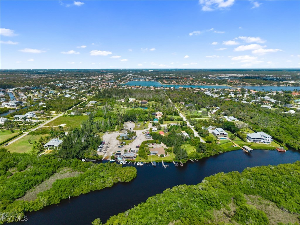 18181 Pioneer Road Fort Myers, FL 33908 - Photo 21 of 22 an aerial view of residential houses with outdoor space and trees all around