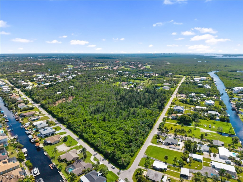 18181 Pioneer Road Fort Myers, FL 33908 - Photo 4 of 22 an aerial view of residential houses with outdoor space