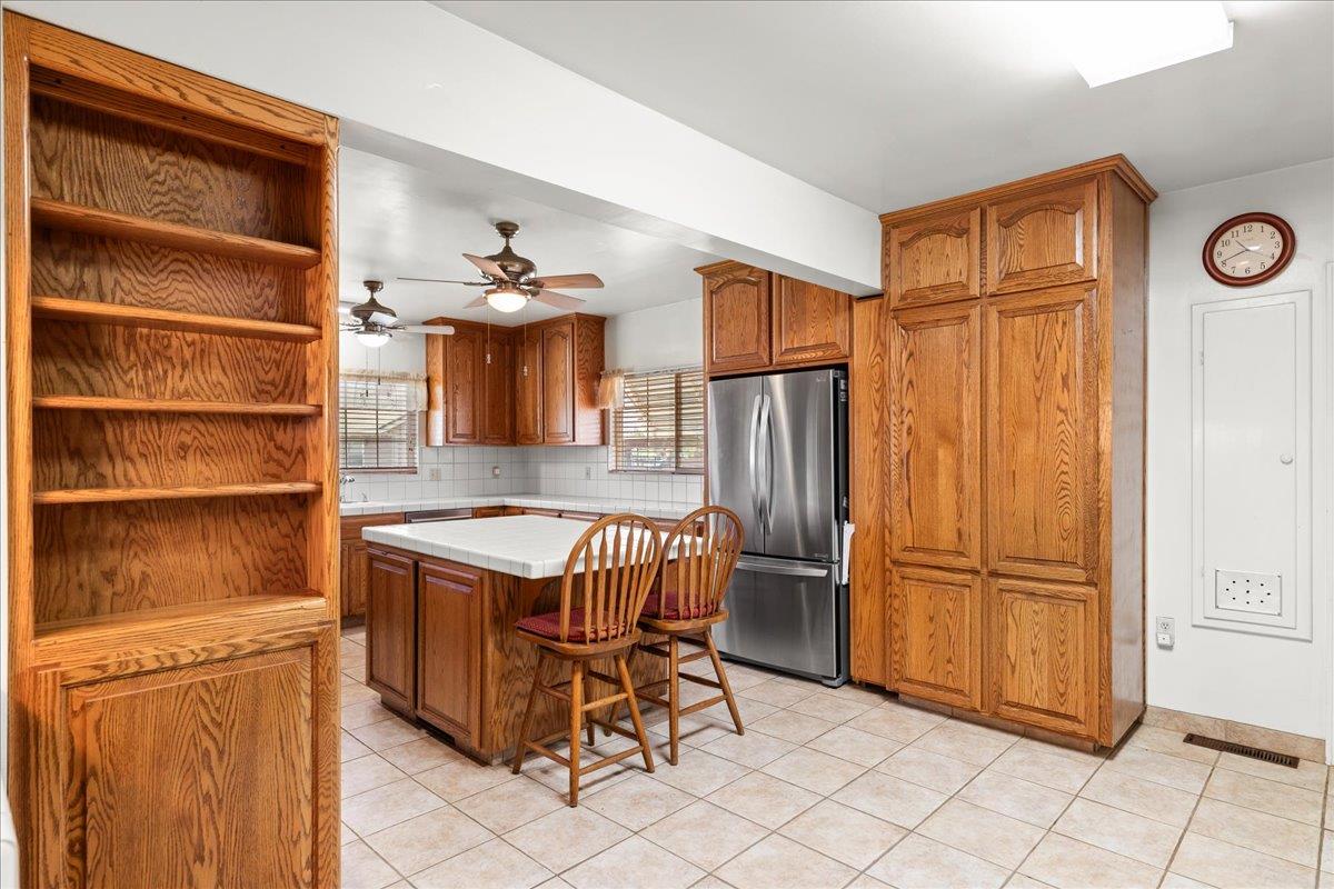 4701 Lone Tree Road Valley Home, CA 95361 - Photo 20 of 59 a kitchen with stainless steel appliances granite countertop a refrigerator and a stove top oven
