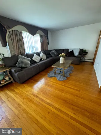 a living room with couch and a table