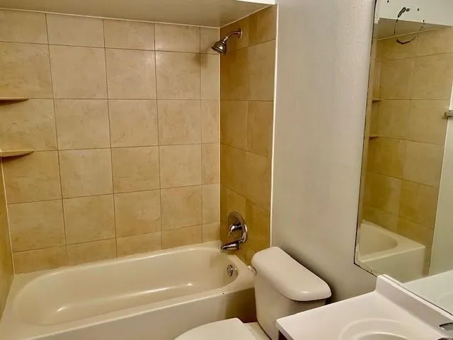 a bathroom with a bathtub and shower