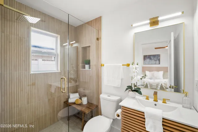a bathroom with a sink toilet tub and shower