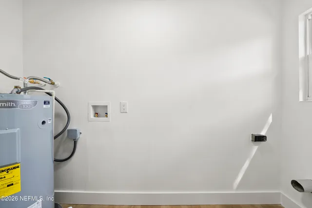 a bathroom with a sink and mirror