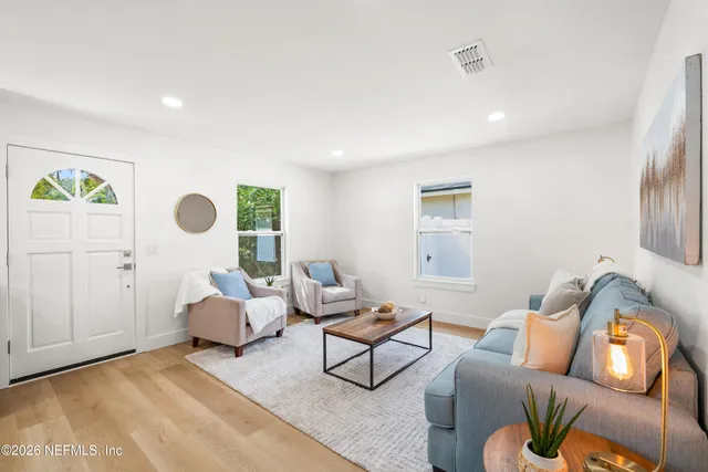 a living room with furniture and a window