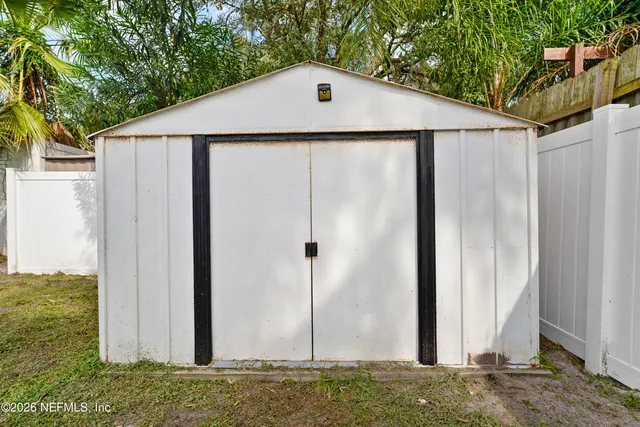 a aerial view of a house with backyard