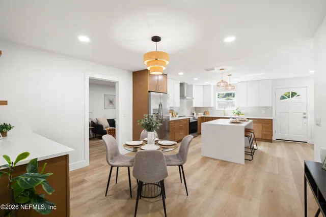 a dining room with a table and chairs
