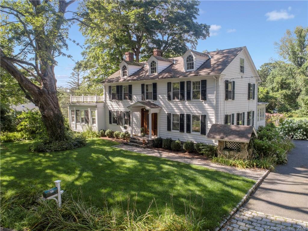 114 Peaceable Street Ridgefield, CT 06877 - Photo 1 of 1 a front view of a house with a garden