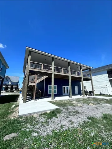 a living room with a table and chairs