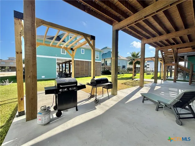 a view of a kitchen with a sink and cabinets