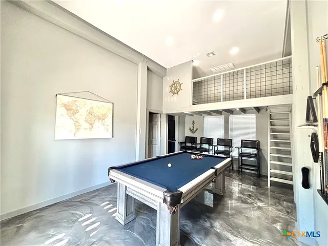 a lobby with furniture and a rug