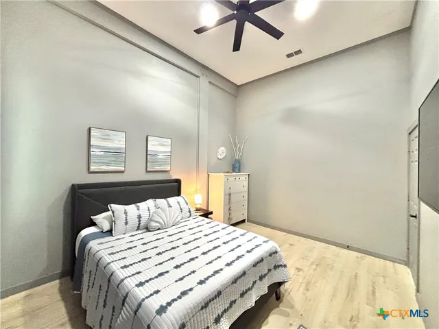 a bathroom with a shower and a window