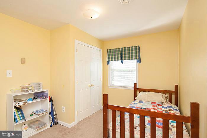 3244 Lineboro Road Manchester, MD 21102 - Photo 13 of 29 a bedroom with a bed and wooden floor