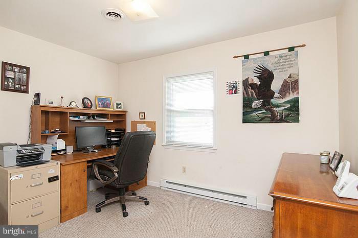 3244 Lineboro Road Manchester, MD 21102 - Photo 15 of 29 a view of a workspace with furniture and a window