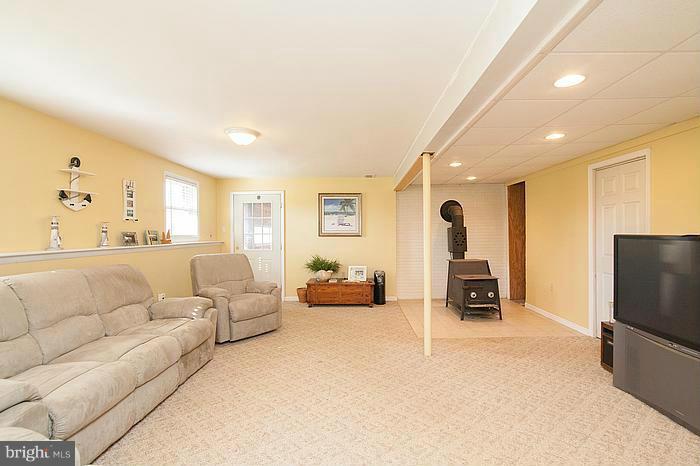 3244 Lineboro Road Manchester, MD 21102 - Photo 20 of 29 a living room with furniture and a flat screen tv