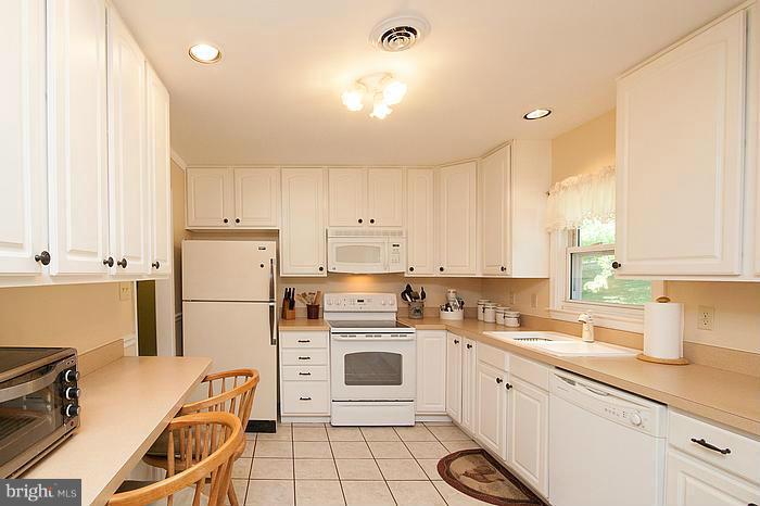 3244 Lineboro Road Manchester, MD 21102 - Photo 3 of 29 a kitchen with a white cabinets and white appliances