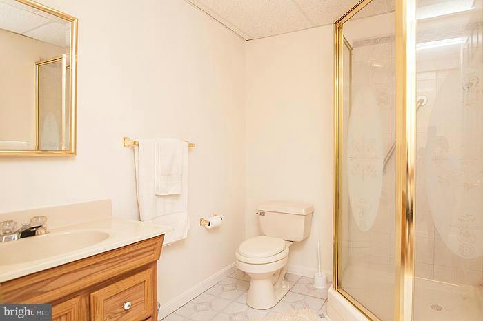 3244 Lineboro Road Manchester, MD 21102 - Photo 22 of 29 a bathroom with a granite countertop sink toilet and shower