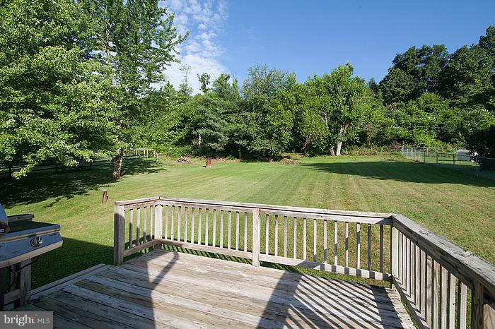 3244 Lineboro Road Manchester, MD 21102 - Photo 23 of 29 a view of a wooden deck with a yard